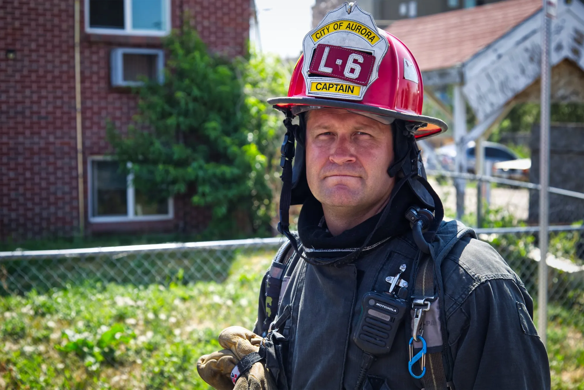 A firefighter in a helmet and turnout gear